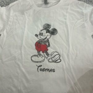 Mickey Mouse shirt size medium. Never been worn personalized to say. “Thomas”